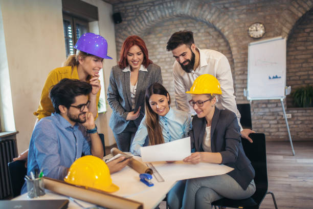istock Business people working in office together. Team work in office. 1031828424