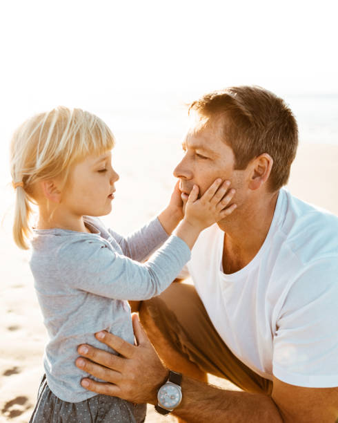 istock lovely daughter kiss the dad 1031832230