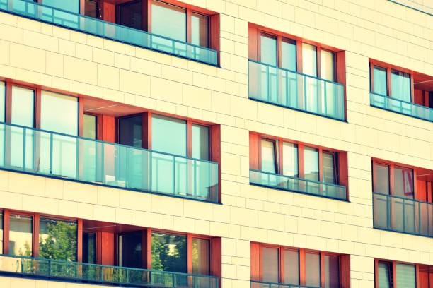 istock Modern apartment building exterior. Retro colors stylization 1031836988