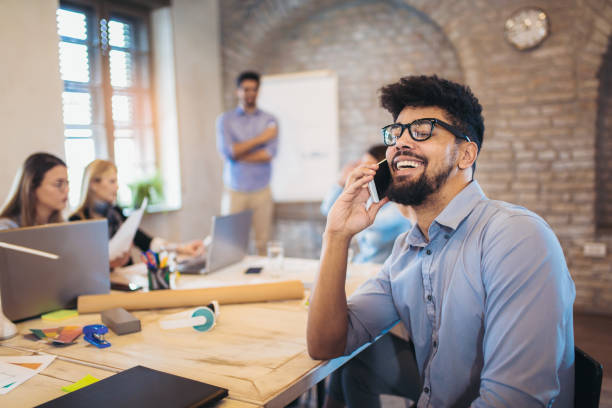 istock Businessman using phone in conference meeting room during presentation 1031837464