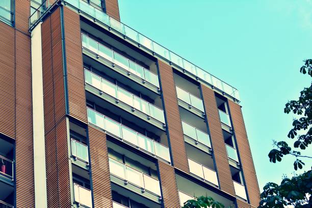 istock Modern apartment building exterior. Retro colors stylization 1031838000