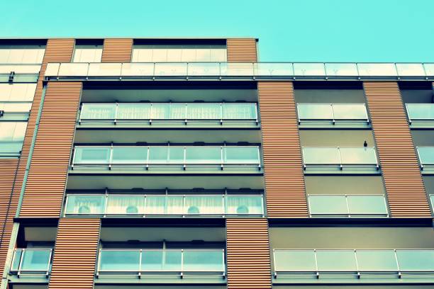 istock Modern apartment building exterior. Retro colors stylization 1031838048
