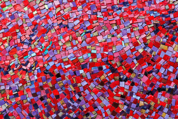 istock Colorful (red, pink, yellow, and purple) stone mosaic tiles on the wall 1031840378