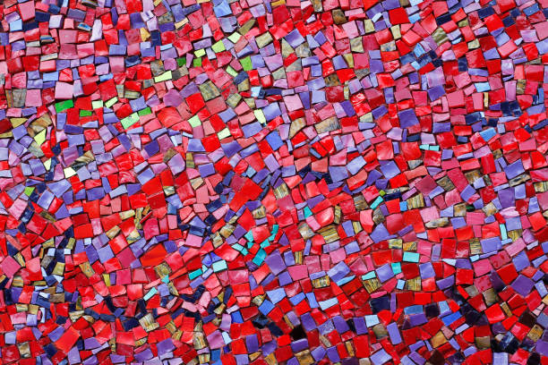 istock Colorful (red, pink, yellow, and purple) stone mosaic tiles on the wall 1031840430