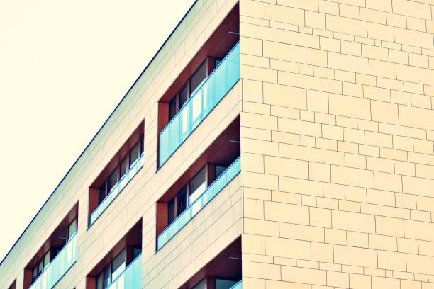 istock Modern apartment building exterior. Retro colors stylization 1031840798