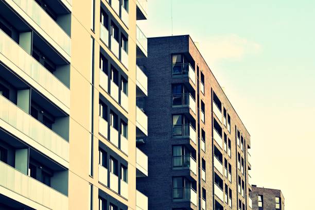 istock Modern apartment building exterior. Retro colors stylization 1031841274