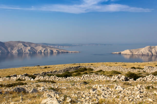 istock Nice calm sea with cliffs and stone, island Krk, Croatia 1031844378
