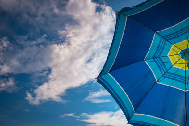 istock Blue parasol on the blue sky background 1031845262