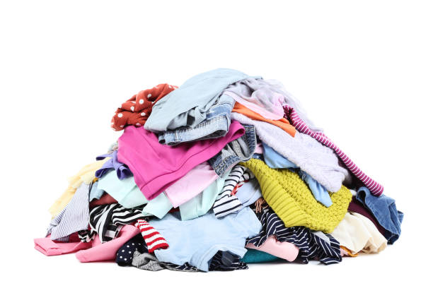 istock Heap of colorful clothes on white background 1031849466
