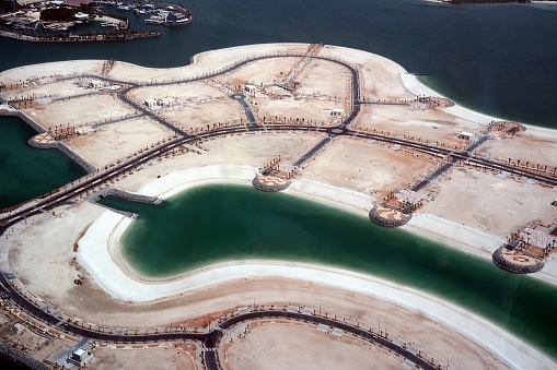 Abu Dhabi coastline with the developing Nareel island, which will become a luxury neighborhood in the capital of United Arab Emirates.