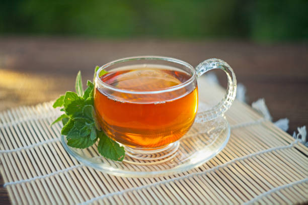 istock delicious green tea in a beautiful glass bowl on table 1031859496