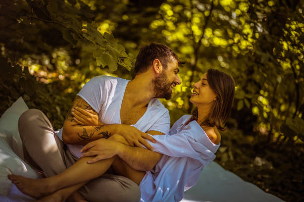 istock Share love in nature. Young couple. 1031859630