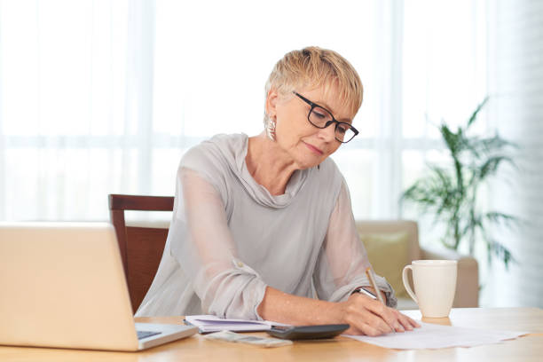 istock Woman counting expenses 1031860484