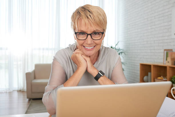 istock Aged woman watching movie 1031860506