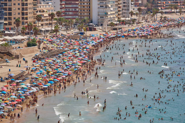 istock Mediterranean coastline in Spain. Calpe beach. Summer crowd. Alicante 1031867376