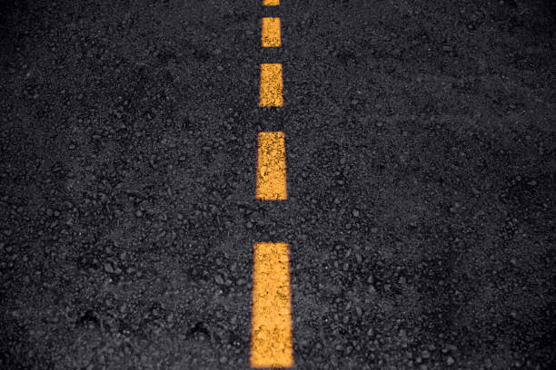 istock asphalt road texture with yellow line clean new freeway or highway  background 1031868244