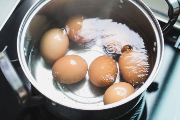 istock boiling eggs or boiled egg cooking in hot water bowl high protein low fat food 1031873194
