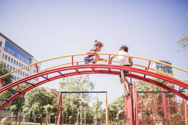 istock Cute little, mixed-race siblings having fun in the park 1031873954