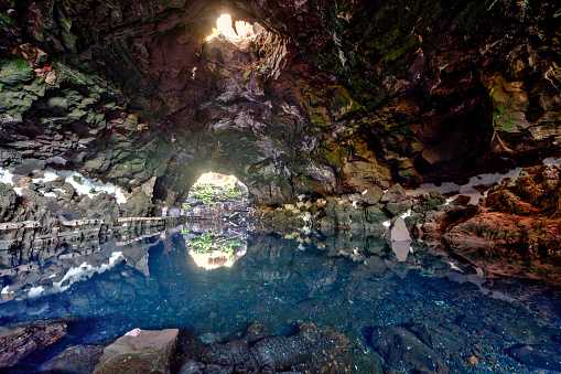 Beautiful cave reflected in the water in Jameos del Agua, Lanzarote, Canary Islands, Spain