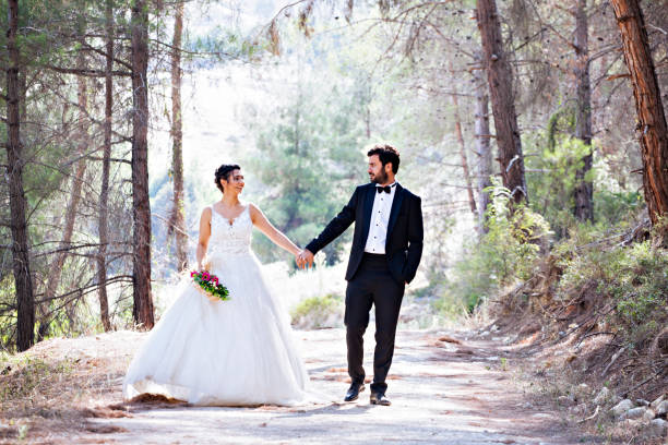 istock Wedding couple walking on road. 1031876294