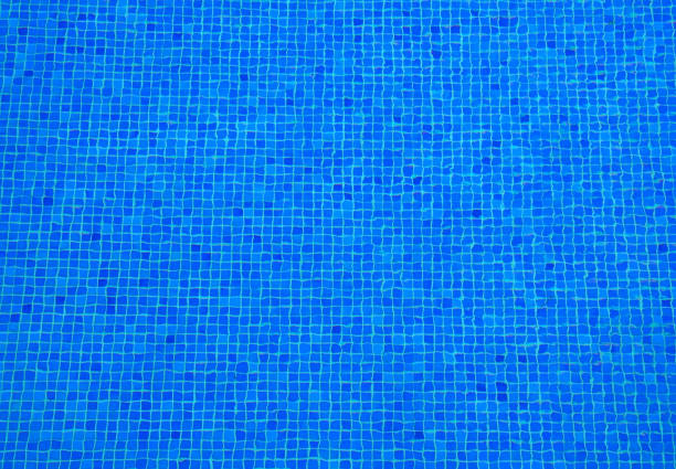 istock Swimming pool mosaic abstract background.Blue ripples geometric texture. 1031877378