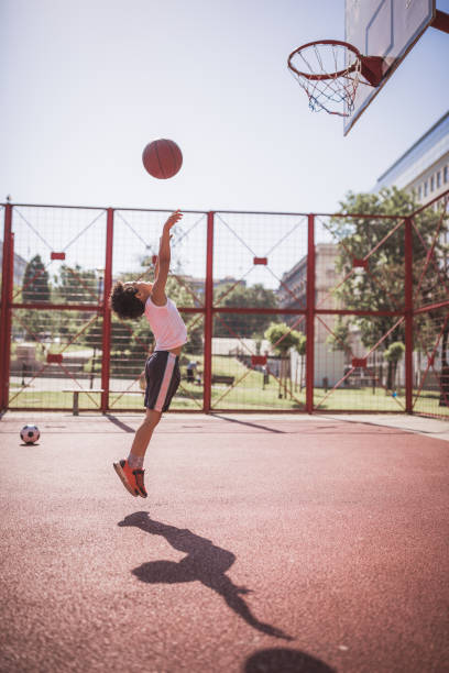 istock Cute little-mixed race boy, playing basketball 1031877694