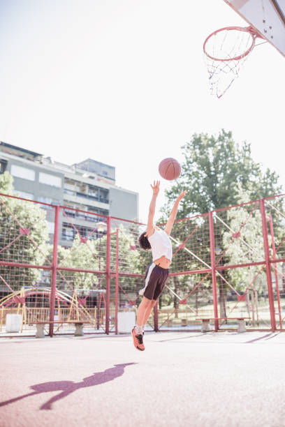 istock Cute little-mixed race boy, playing basketball 1031877748