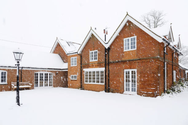 istock Large Victorian house in winter 1031879924