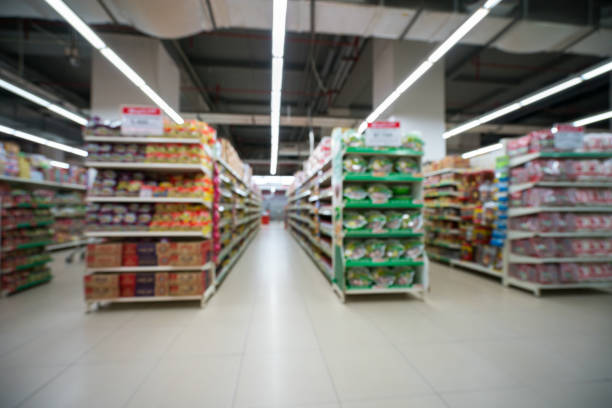 istock Supermarket blurred background with colorful shelves and unrecognizable customers 1031881464