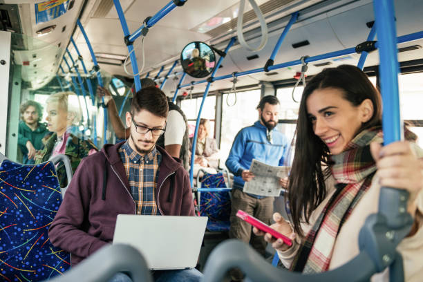istock Overworked freelancer working on laptop in public bus 1031881512
