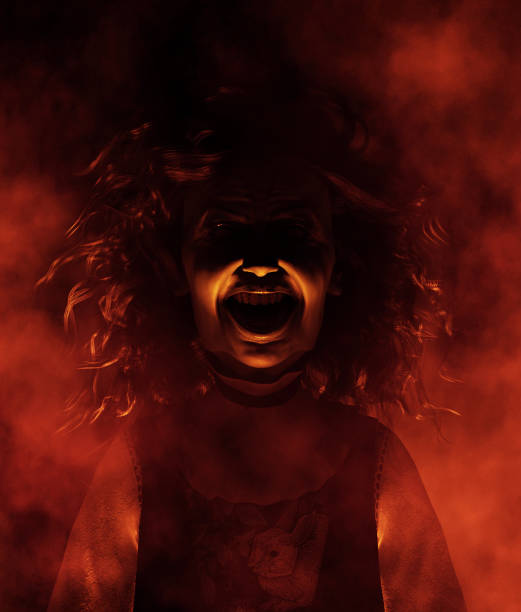 Voodoo Priestess crawling on the floor. This stock image has a horizontal composition.