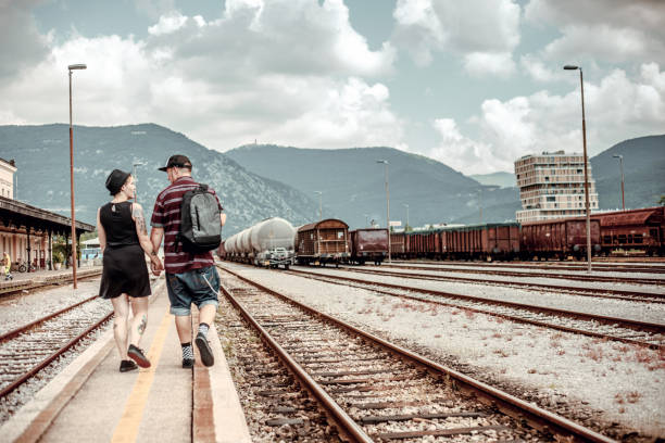 istock Young Adult Couple Waiting for Train 1031886016