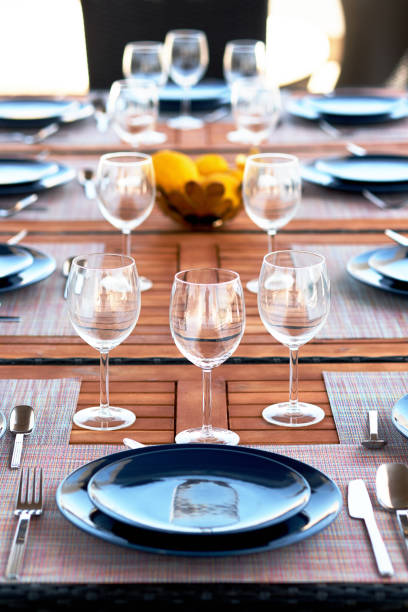 istock Table setting with a wine glasses, cutlery and plates 1031886460