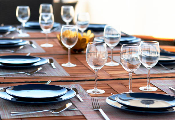 istock Table setting with a wine glasses, cutlery and plates 1031886484