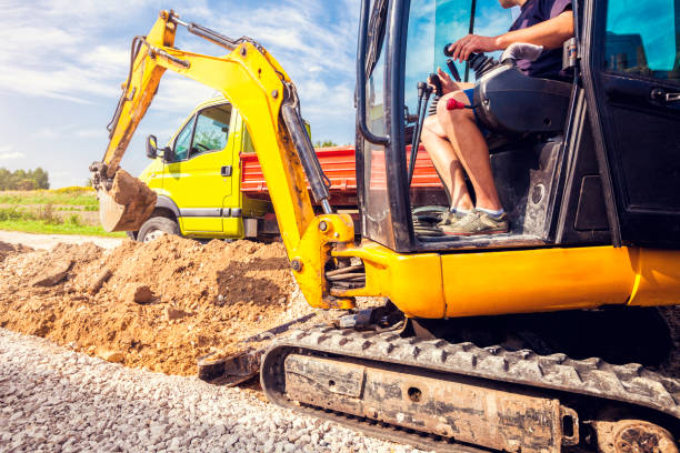 istock Excavator digs the foundation for the house 1031886856