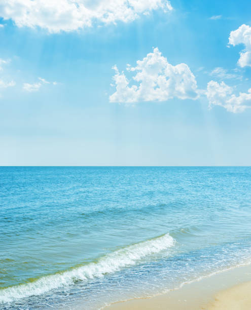 istock blue sky with clouds over sea and sand beach 1031886998