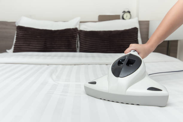 Mite Vacuum Cleaner Using Cleaning Bed Mattress Dust Eliminator With Uv Lamp Stock Photo - Download Image Now - iStock