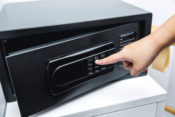 istock closeup hand key password open safe box door 1031889612