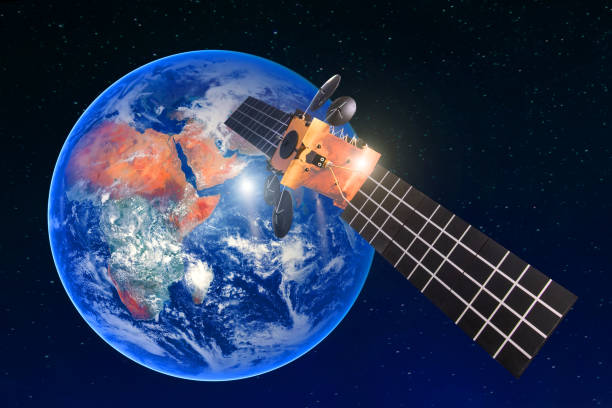 istock Satellite telecommunication connection, transmits radio communication on the geostationary orbit of the Earth. Against the background of the planet. Elements of this image furnished by NASA. 1031889750
