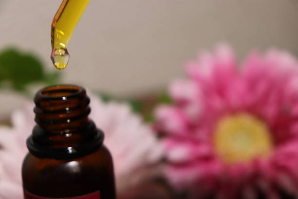 istock Eyedropper from oil bottle and flower 1031890670