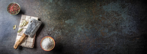 old meat butcher on dark concrete board with spices salt and pepper. - butchers shop imagens e fotografias de stock