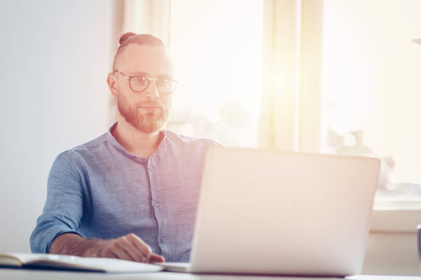 istock Young businessman working on laptop 1031894622