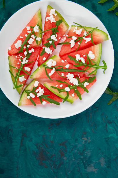 istock Fresh summer watermelon salad with feta cheese and arugula 1031900478