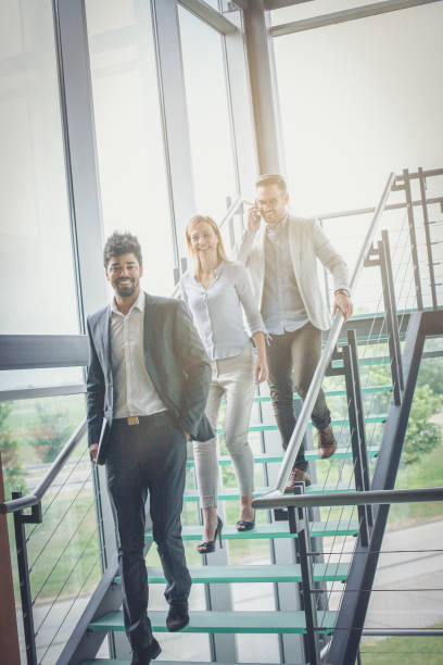 istock Business people walking on the stairs and having discussion. 1031904706