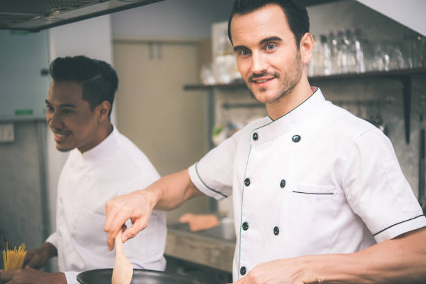 istock Chef preparing food in the kitchen of a restaurant 1031905576
