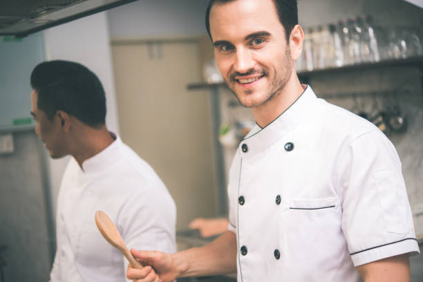 istock Chef preparing food in the kitchen of a restaurant 1031905600
