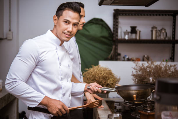 istock Chef preparing food in the kitchen of a restaurant 1031905622