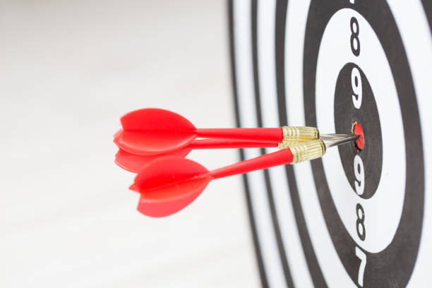 istock Target dart arrow hitting in the center of dartboard 1031908736