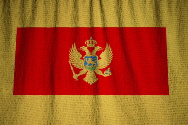 istock Closeup of Ruffled Montenegro Flag 1031908812