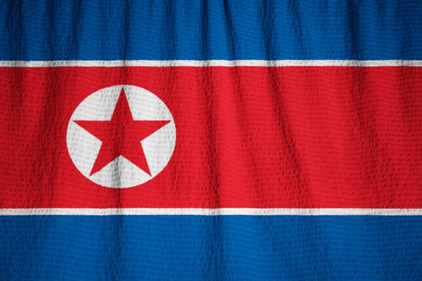 istock Closeup of Ruffled North Korea Flag 1031912834